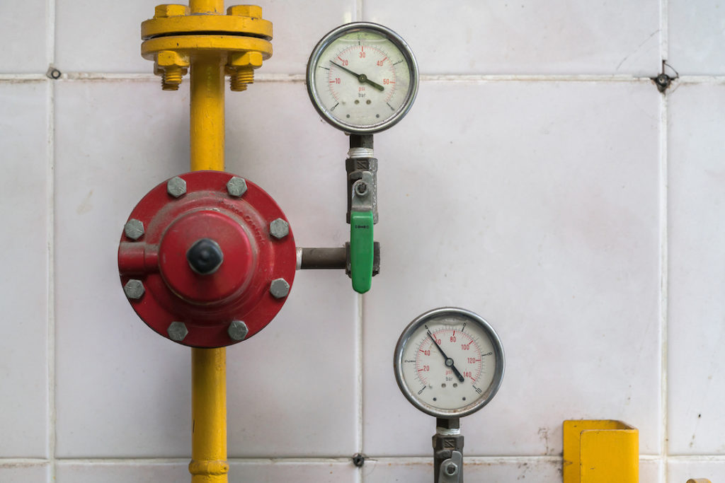 yellow and red home gas meter