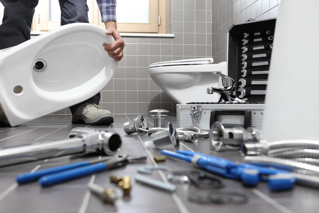Toilet installation work in a bathroom