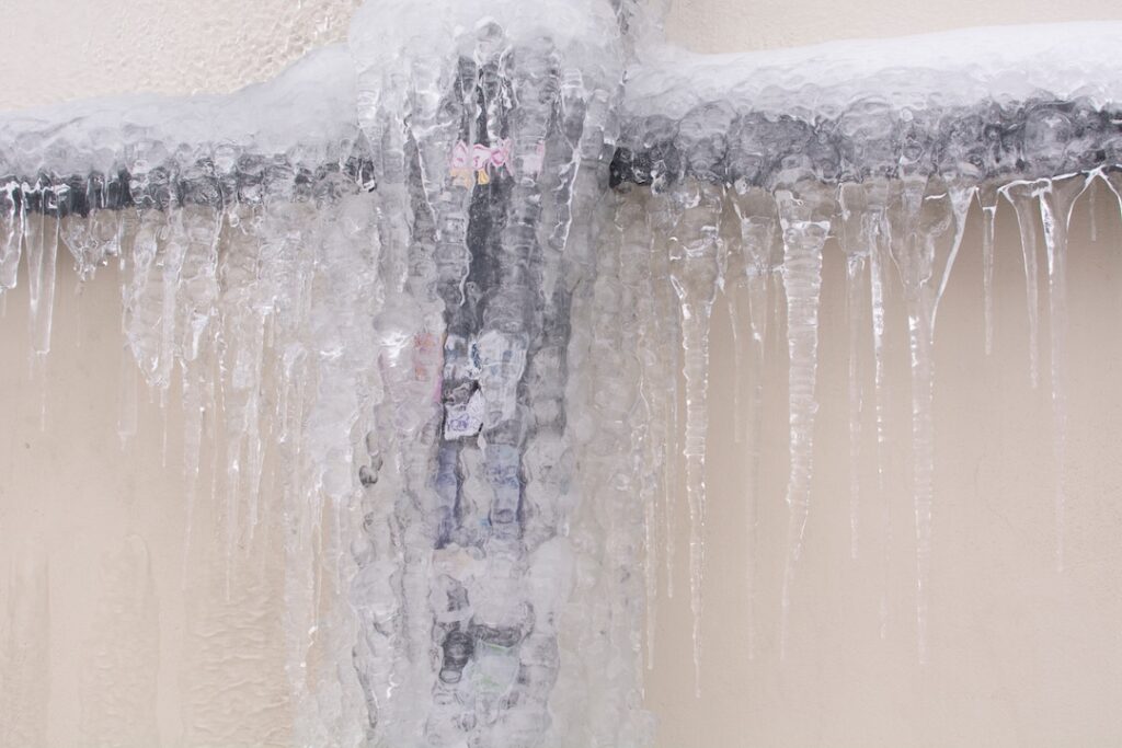 Frozen pipes. Ice on the pipes. Winter and frost.